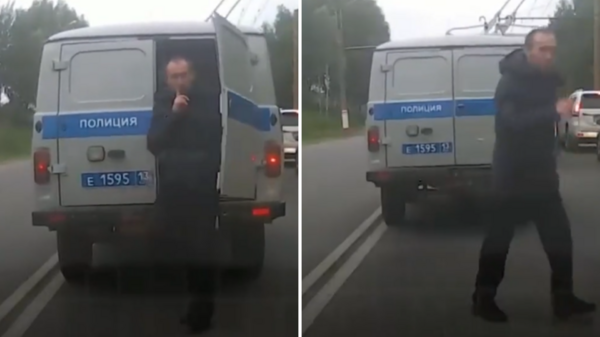 俄羅斯男子趁交通堵塞從「警車後門」溜走，還向後方司機打「噤聲」手勢