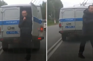 俄羅斯男子趁交通堵塞從「警車後門」溜走，還向後方司機打「噤聲」手勢